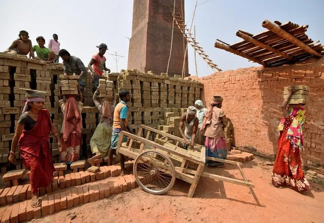 Labourers work at a brick factory at Rupahi village in Nagaon district in the northeastern state of Assam, India, March 7, 2017. (Photo by Anuwar Hazarika/Reuters)