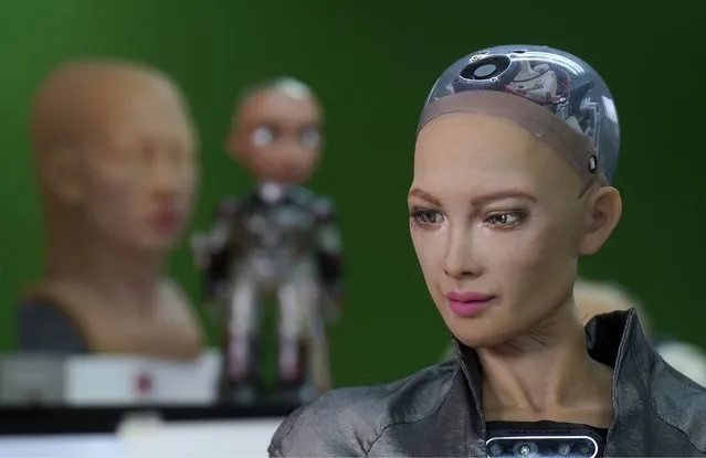 The close-up of the head of Sophia is seen at Hanson Robotics studio in Hong Kong on March 29, 2021. Sophia is a robot of many talents, she speaks, jokes, sings and even makes art. In March, she caused a stir in the art world when a digital work she created as part of a collaboration was sold at an auction for $688,888 in the form of a non-fungible token (NFT). (Photo by Vincent Yu/AP Photo)