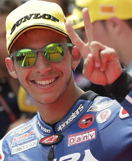 Enea Bastianini of Italy and Junior Team Gresini Moto3 gestures after clocking the fastest time to take pole position for Sunday's Spanish Motorcycling, in Montmelo, Spain, Saturday, June 13, 2015. The Catalunya Grand Prix will take place on Sunday in Montmelo. (AP Photo/Manu Fernandez)