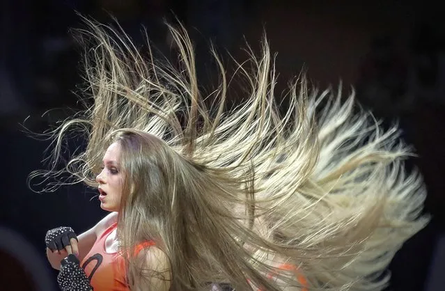 The hair of CSKA Moscow cheerleaders flies high as they perform during the Euroleague Basketball game between Alba Berlin and CSKA Moscow in Moscow, Russia, 04 February 2022. (Photo by Yuri Kochetkov/EPA/EFE)