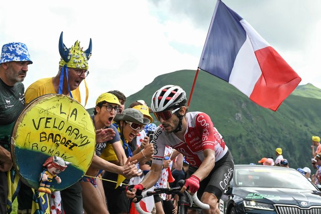 Cofidis team's French rider Guillaume Martin cycles past spectators in the Pas de Peyrol (Puy Mary) ascent during the 11th stage of the 111th edition of the Tour de France cycling race, 211 km between Évaux-les-Bains and Le Lioran, on July 10, 2024. (Photo by Marco Bertorello/AFP Photo)