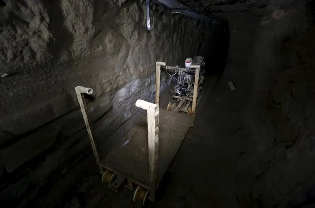 A rail cart attached to a modified motorcycle is seen inside a tunnel connected to the Altiplano Federal Penitentiary and used by drug lord Joaquin “El Chapo” Guzman to escape, in Almoloya de Juarez, on the outskirts of Mexico City, July 15, 2015. (Photo by Edgard Garrido/Reuters)