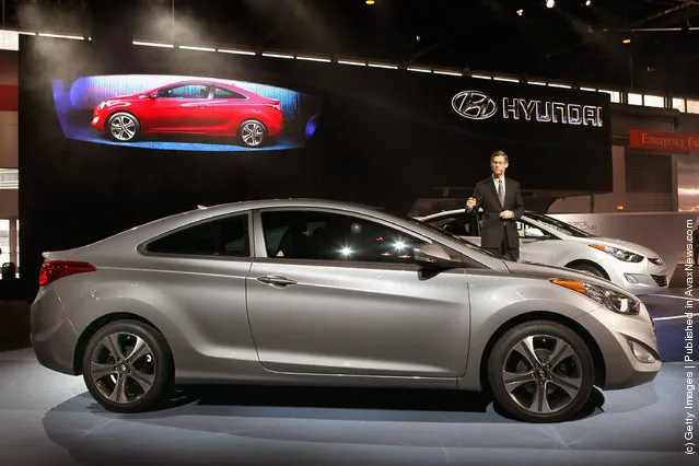 Mike O'Brien, vice president of product and corporate planning at Hyundai, introduces the 2013 Hyundai Elantra Coupe during the media preview of the Chicago Auto Show