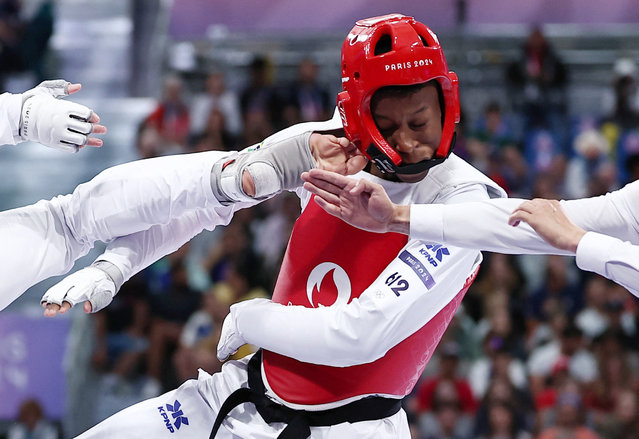 Henrique Marques Rodrigues Fernandes of Brazil in action with Saleh Elsharabaty of Jordan in the Men's under 80 kgs during the Olympic Games Paris 2024 – Taekwondo – Day 3 at Grand Palais on August 9, 2024 in Paris, France. (Photo by Tingshu Wang/Reuters)