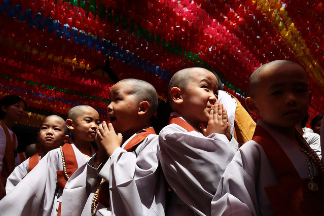 South Korean child monks attend during a ceremony to prepare children to live as Buddhist monks for three weeks at Jogyesa Temple on May 09, 2023 in Seoul, South Korea. As part of the celebration of Buddha's birthday, young children are annually invited to become Buddhist monks for a three-week period. (Photo by Chung Sung-Jun/Getty Images)