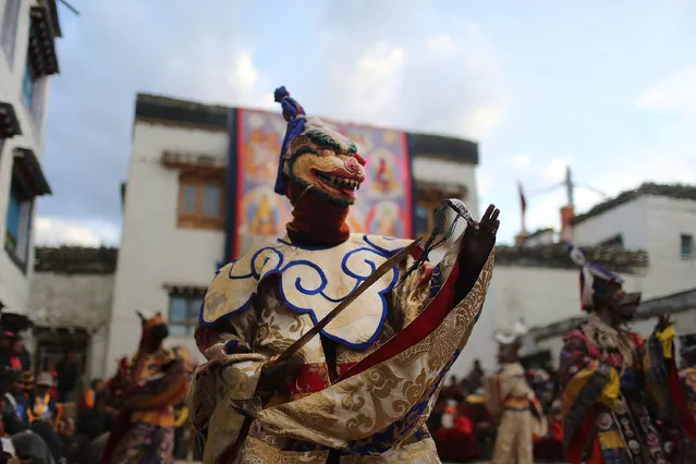 Elaborately dressed monks perform dances during the Tenchi Festival on May 26, 2014 in Lo Manthang, Nepal. The Tenchi Festival takes place annually in Lo Manthang, the capital of Upper Mustang and the former Tibetan Kingdom of Lo. Each spring, monks perform ceremonies, rites, and dances during the Tenchi Festival to dispel evils and demons from the former kingdom. (Photo by Taylor Weidman/Getty Images)