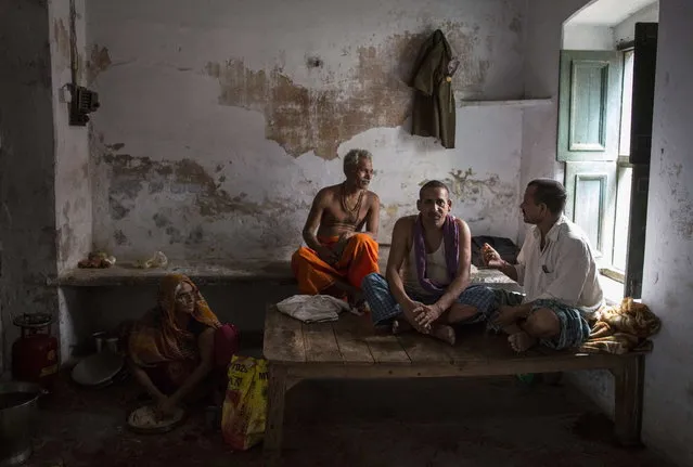 Relatives of Munna Kuvar, 105, sit inside her room at Mukti Bhavan (Salvation House) in Varanasi, in the northern Indian state of Uttar Pradesh, June 18, 2014. (Photo by Danish Siddiqui/Reuters)