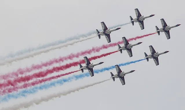 AT-3 jet trainer aircrafts perform during an air force drill at Chingchuankang Air Force Base in Taichung, central Taiwan, July 17, 2014. (Photo by Pichi Chuang/Reuters)