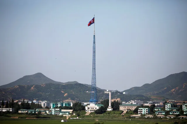 A North Korean flag flutters on top of a tower at the propaganda village of Gijungdong in North Korea, in this picture taken near the truce village of Panmunjom, South Korea, August 26, 2017. (Photo by Kim Hong-Ji/Reuters)