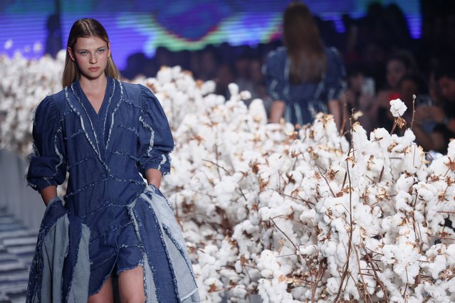 A model presents a creation by the project “Sou de algodao” (I'm made of cotton) during Sao Paulo Fashion Week, in Sao Paulo, Brazil on November 9, 2023. (Photo by Carla Carniel/Reuters)