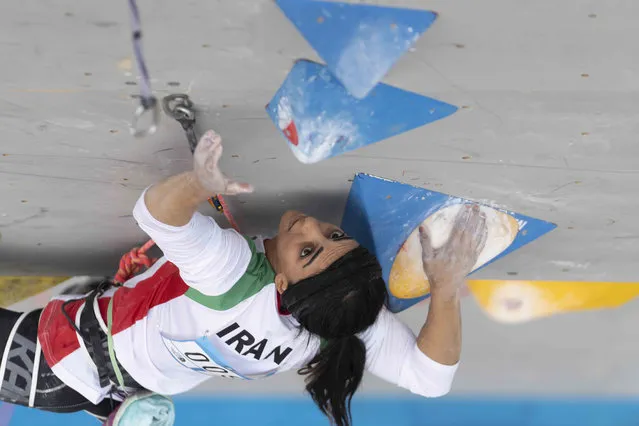 Iranian athlete Elnaz Rekabi competes during the women's Boulder & Lead final during the IFSC Climbing Asian Championships in Seoul, Sunday, October 16, 2022. Rekabi left South Korea on Tuesday, Oct. 18, 2022 after competing at an event in which she climbed without her nation's mandatory headscarf covering, authorities said. Farsi-language media outside of Iran warned she may have been forced to leave early by Iranian officials and could face arrest back home, which Tehran quickly denied. (Photo by Rhea Khang/International Federation of Sport Climbing via AP Photo)