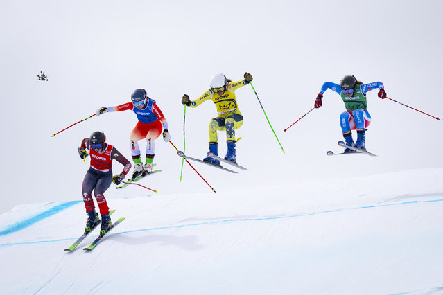 (L-R) Courtney Hoffos of Canada, Talina Gantenbein of Switzerland, Luisa Klapprott of Germany, and Anouck Errard of France in action during the Skicross competition FIS Snowboard & Freestyle World Championships in St. Moritz, Switzerland, 21 March 2025. (Photo by Gian Ehrenzeller/EPA/EFE)