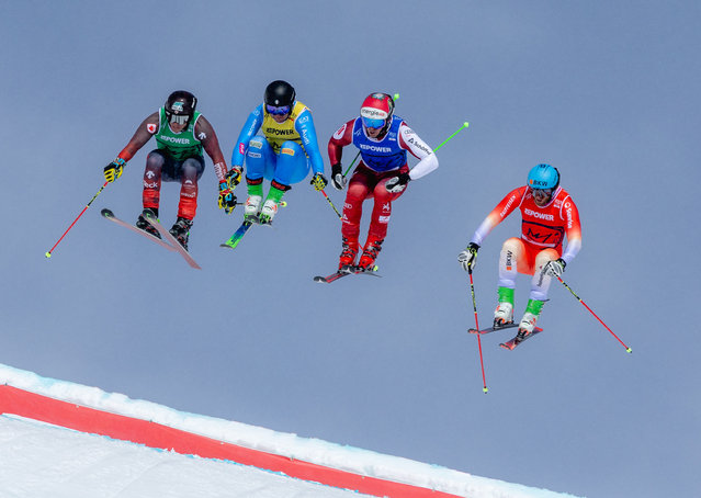 (L-R) Kevin Drury of Team Canada, Yanick Gunsch of Team Italy, Johannes Rohrweck of Team Austria and Alex Fiva of Team Switzerland compete during the Mixed Team Ski Cross Quarterfinal 2 of the of the FIS Snowboard, Freestyle and Freeski World Championships 2025 on March 22, 2025 in Corviglia, St. Moritz, Switzerland. (Photo by Marcus Hartmann/Getty Images)