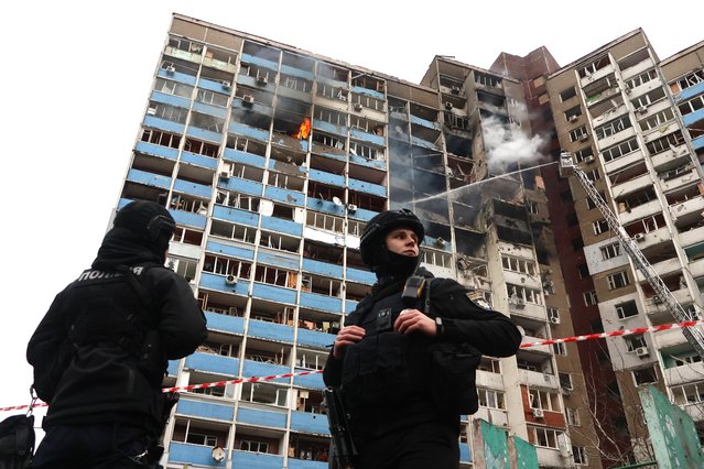 Ukrainian rescuers extinguish a fire in a residential building following a missile attack in Kyiv amid the Russian invasion of Ukraine. Russia launched a missile strike on Kyiv, Ukraine, according to the statement from local authorities, more than 20 rockets were shot down. (Photo by Aleksandr Gusev/SOPA Images/LightRocket via Getty Images)