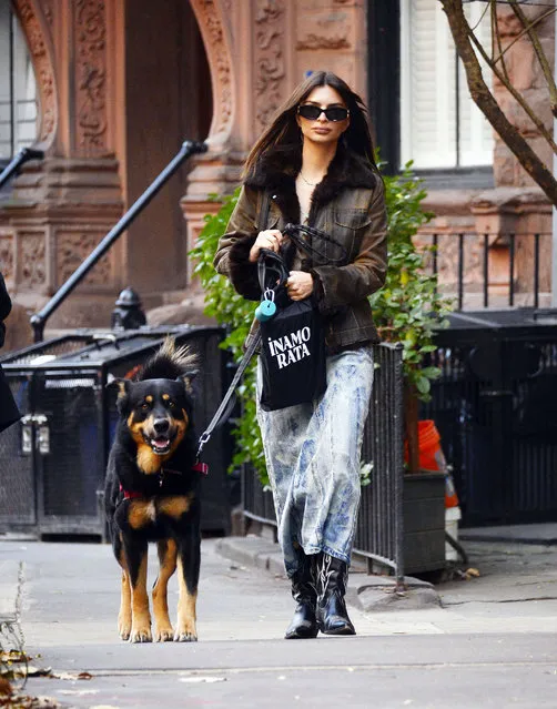 Emily Ratajkowski is pictured on a dog walk in New York City on November 23, 2022. The sighting comes after Emily got a visit from DJ Orazio Rispo just a few days after her date with Pete Davidson. The American supermodel wore a leather jacket, crop top, denim skirt, and cowboy boots. (Photo by The Image Direct)