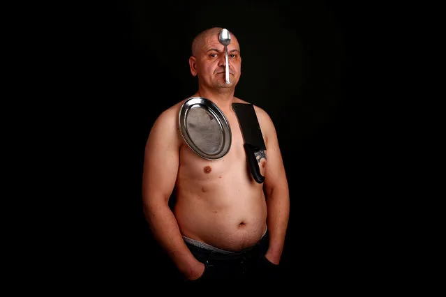 Nermin Halilagic, 38, poses with kitchen utensils in Bihac, Bosnia and Herzegovina January 23, 2017. Halilagic discovered earlier this year that he had the unusual ability to attach items to his body using what he says is a special energy radiated from his body. Without making any special preparation, he says he is able to hold on to spoons, forks, knives, and other kitchen appliances, as well as non-metal objects like remote controls, all plastic stuff, and cell phones. (Photo by Dado Ruvic/Reuters)