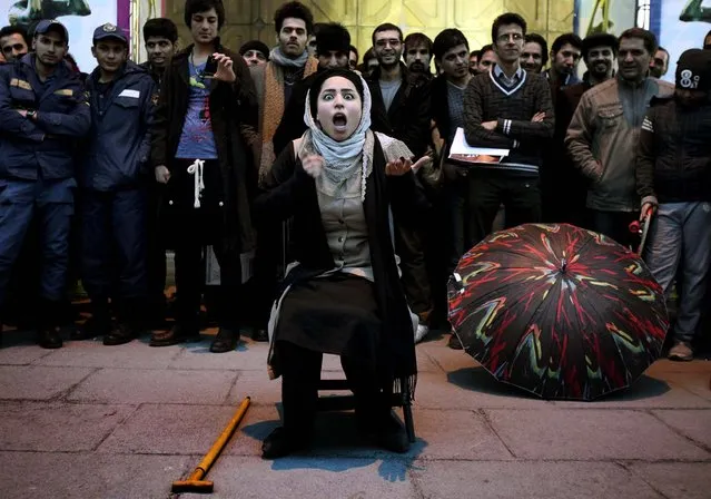 Iranian actress Elaheh Pourjamshid performs her role as a mother in “Awakening of The Particles” street theater, telling a story about children's education, during the 31st Fajr International Theater Festival in Tehran, January 17, 2013. The Fajr festival is the most important theatrical event in the country and marks the anniversary of the 1979 Islamic revolution. (Photo by Vahid Salemi/Associated Press)