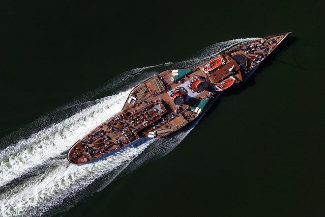 The Waverley, the world's last seagoing paddle steamer, as it makes its way along the River Clyde on the first sailing of the year on Friday, May 16, 2025. The Waverley was built in 1945, originally for the route up Loch Goil and Loch Long from Craigendoran & Arrochar in West Scotland. She now visits several areas of the UK offering regular trips during the summer months. (Photo by Jane Barlow/PA Wire)