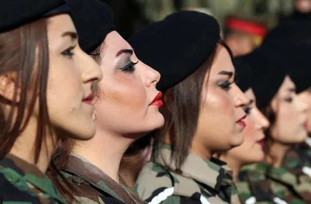 Iraqi Kurdish Peshmerga take part in a graduation ceremony at the Zakho military academy in the Iraqi Kurdish town of Zakho, some 500 kilometres north of Baghdad, on January 30, 2018. Some four- hundred eighteen male and female Peshmerga completed their military training and graduated from the academy. (Photo by Safin Hamed/AFP Photo)
