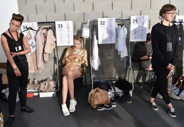 A model waits backstage before the show for fashion house Diesel Black Gold during the 2017 Women's Spring / Summer collections shows at Milan Fashion Week on September 23, 2016 in Milan. (Photo by Alberto Pizzoli/AFP Photo)