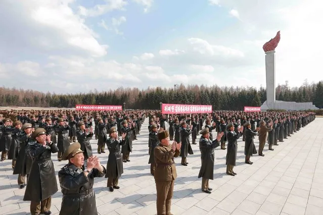 Korean People's Army pilots who have completed a tour of battle sites in the area of Mt Paektu applaud during a visit by North Korean leader Kim Jong Un in this undated photo released by North Korea's Korean Central News Agency (KCNA) on April 19, 2015. (Photo by Reuters/KCNA)