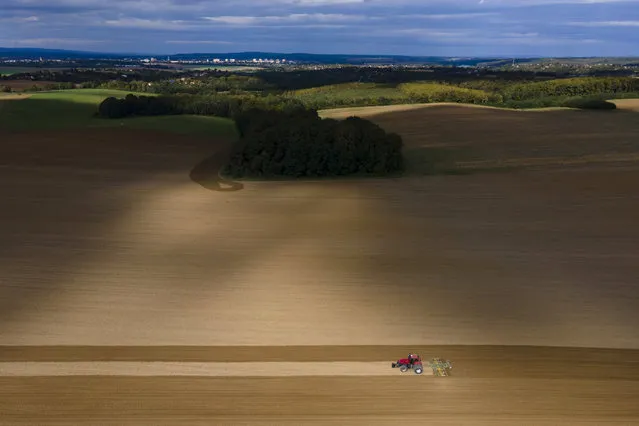 A cultivator is used to loosen the soil and prepare it for autumn sowing near the Miklosfa district of Nagykanizsa, Hungary, 30 September 2020. (Photo by Gyorgy Varga/EPA/EFE)