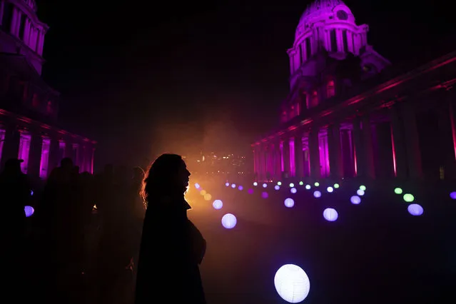 Lights shine up into the sky during a night display of light illustration celebrating the Lunar new year at the Old Royal Naval College at Greenwich in London, United Kingdom on January 21, 2023. (Photo by Rasid Necati Aslim/Anadolu Agency via Getty Images)