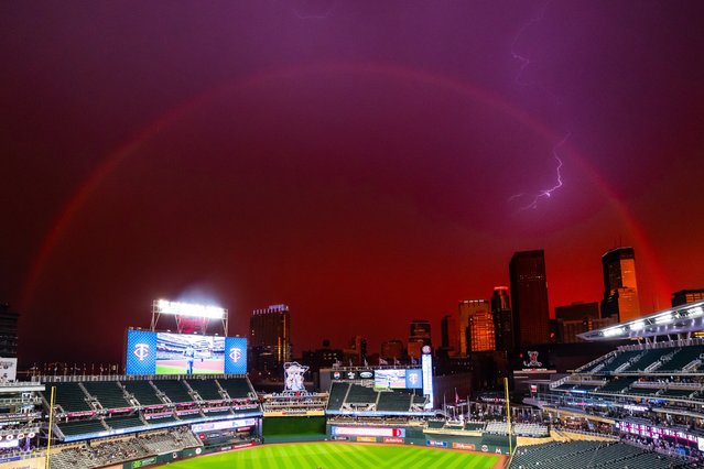 A general view of a rainbow and a lightning strike during a rain delay in the second inning between the Minnesota Twins and Atlanta Braves on August 26, 2024 at Target Field in Minneapolis, Minnesota. (Photo by Brace Hemmelgarn/Minnesota Twins/Getty Images)