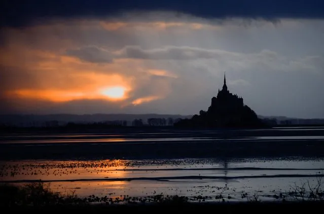 The iconic Mont Saint-Michel is seen at sunset in the French western region of Normandy, France on January 16, 2023. (Photo by Stephane Mahe/Reuters)