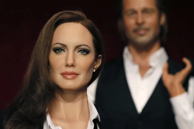 The wax figures of Angelina Jolie and Brad Pitt are displayed at the Grevin wax museum during a press presentation in Paris July 3, 2014. (Photo by Gonzalo Fuentes/Reuters)