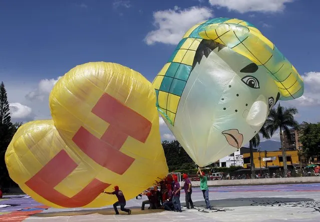 Balloons in tribute of comedian Roberto Gomez Bolanos are seen during the 14th Solar Balloon Festival in Envidago December 31, 2014. (Photo by Fredy Builes/Reuters)