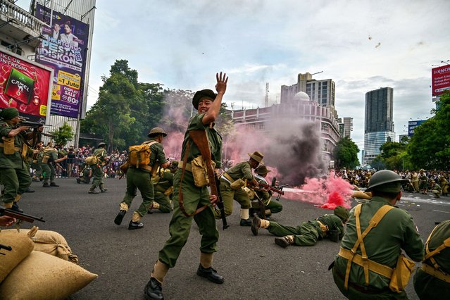 Members of the Roodebrug Soerabaia Community and Reenactor Indonesia take part in a re-enactment of the Battle of Surabaya, the peak of the battle which took place in November 1945 between Indonesian nationalists against British and British Indian forces for the re-imposition of Dutch colonial rule following the end of World War II, in Surabaya on November 2, 2025. (Photo by Juni Kriswanto/AFP Photo)