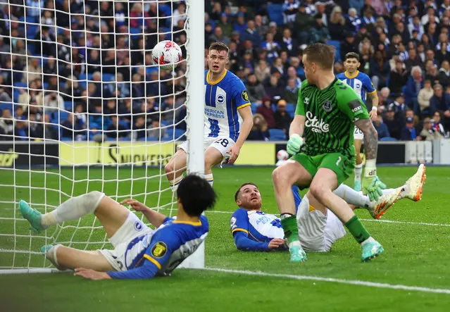 Brighton & Hove Albion's Alexis Mac Allister scores their first goal  during the English Premier League football match between Brighton and Hove Albion and Everton at the American Express Community Stadium in Brighton, southern England on May 8, 2023. (Photo by Matthew Childs/Action Images via Reuters)