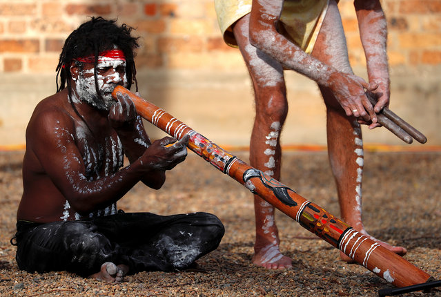 Aboriginal performer known as “Turtle” plays a didgeridoo as he participates in a ceremony with fellow performer Terry Olsen to mark the start of National Reconciliation Week for Aboriginal and Torres Strait Islanders in Sydney, Australia, May 28, 2018. (Photo by David Gray/Reuters)