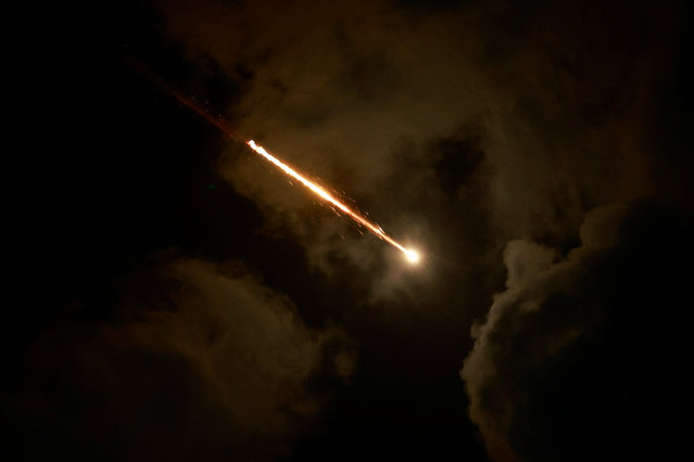 A rocket flies in the sky, as seen from Tel Aviv, Israel, on October 1, 2024. (Photo by Ammar Awad/Reuters)