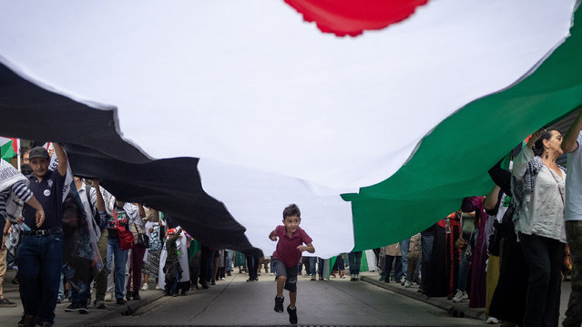 Pro-Palestinian activists take part in a demonstration in Guatemala City, Guatemala, 06 October 2024. The Palestinian community in Guatemala held a march in which they demanded the 'cessation of genocide' by Israel in Gaza and also asked the Central American country to cut diplomatic relations with the Government of Israeli Prime Minister Benjamin Netanyahu. More than 41,800 Palestinians and over 1,400 Israelis have been killed, according to the Palestinian Health Ministry and the Israel Defense Forces (IDF), since Hamas militants launched an attack against Israel from the Gaza Strip on 07 October 2023, and the Israeli operations in Gaza and the West Bank which followed it. (Photo by David Toro/EPA)