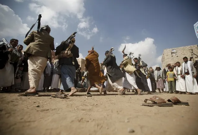 Tribesmen loyal to the Houthi movement perform the traditional Baraa dance at a gathering to show their support for the group, in Yemen's capital Sanaa December 15, 2015. (Photo by Khaled Abdullah/Reuters)