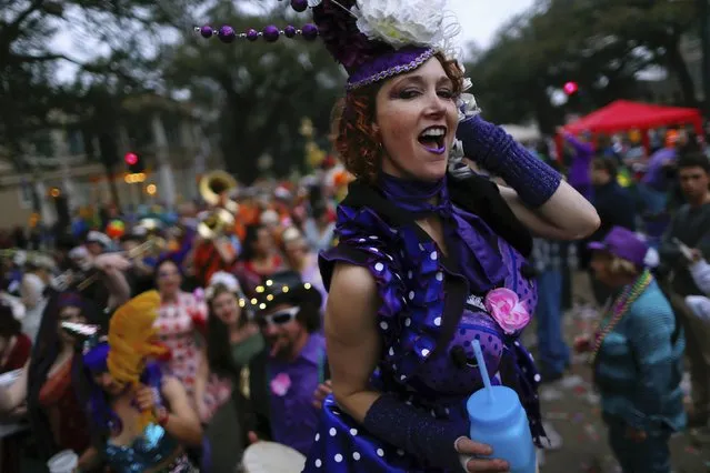 A member of the Krewe of Box of Wine makes her way down St. Charles Avenue in between Mardi Gras parades in New Orleans, Louisiana February 15, 2015. (Photo by Jonathan Bachman/Reuters)