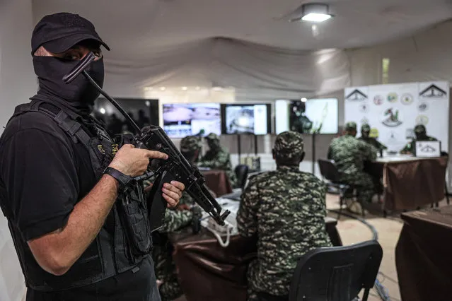 Fighters from the Joint Operations Room of Gaza-based armed Palestinian factions hold a military drill in front of the media in Khan Yunis in the southern Gaza Strip on September 12, 2023, to mark the anniversary of the 2005 Israeli withdrawal from Gaza. (Photo by Said Khatib/AFP Photo)