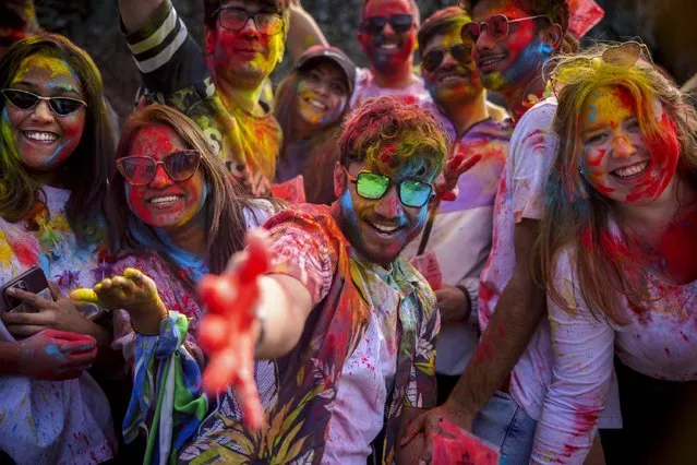 About 2,000 revellers took part in the Holi Festival of Colours in Leeds, United Kingdom on March 11, 2023 – an Indian festival that celebrates the triumph of good over evil. (Photo by James Glossop/The Times)