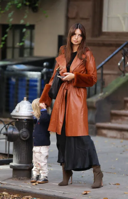 American model Emily Ratajkowski seen walking holding her son's hand outside her apartment in the West Village in New York City on October 9, 2023. (Photo by Eric Kowalsky/The Mega Agency)