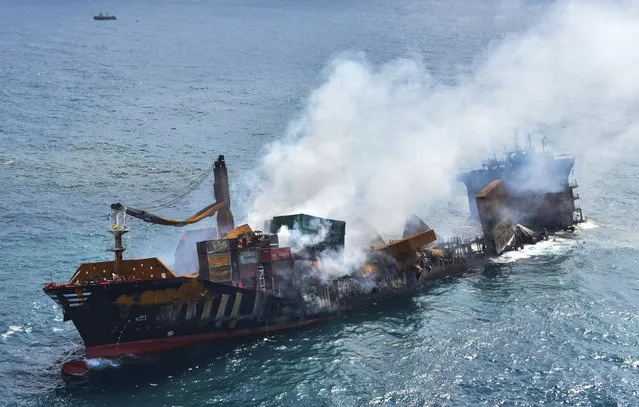 This photo provided by Sri Lankan Air Force shows the sinking MV X-Press Pearl at Kapungoda where it is anchored off Colombo port, Sri Lanka, Wednesday, June 2, 2021. Salvage experts were attempting to tow the fire-stricken container ship that had been loaded with chemicals into the deep sea as the vessel started to sink Wednesday. Water submerged the MV X-Press Pearl's quarterdeck a day after firefighters extinguished a blaze that had been burning for 12 days. (Photo by Sri Lanka Air Force via AP Photo)