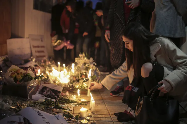 Moroccans lay flowers and messages during a candlelight vigil outside the Norwegian embassy in Rabat for two Scandinavian university students who were killed in a terrorist attack in a remote area of the Atlas Mountains, Morocco, Saturday, December 22, 2018. Moroccans gathered Saturday in front of the Norwegian and Danish embassies in Rabat in a candlelight vigil to honor two Scandinavian university students killed in a terrorist attack in the Atlas Mountains. (Photo by Mosa'ab Elshamy/AP Photo)