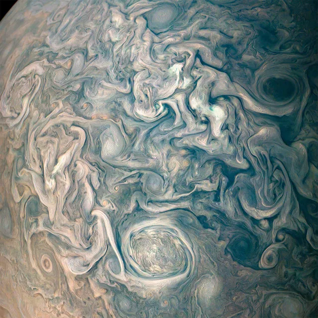 Swirling cloud belts and vortices are seen in Jupiter's northern hemisphere in this color-enhanced image taken by NASA's Juno spacecraft on a close flyby, May 23, 2018. (Photo by NASA/JPL-Caltech/SwRI/MSSS/Gerald Eichstadt/Sean Doran/Handout via Reuters)