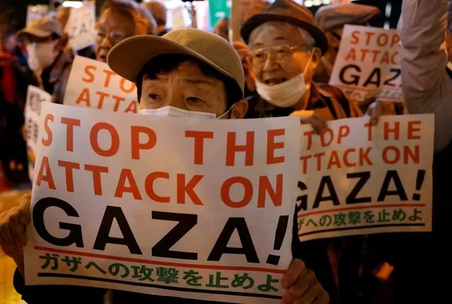 People hold a rally to protest against Israel's attack on Gaza near the Israeli embassy in Tokyo, Japan on October 16, 2023. (Photo by Issei Kato/Reuters)
