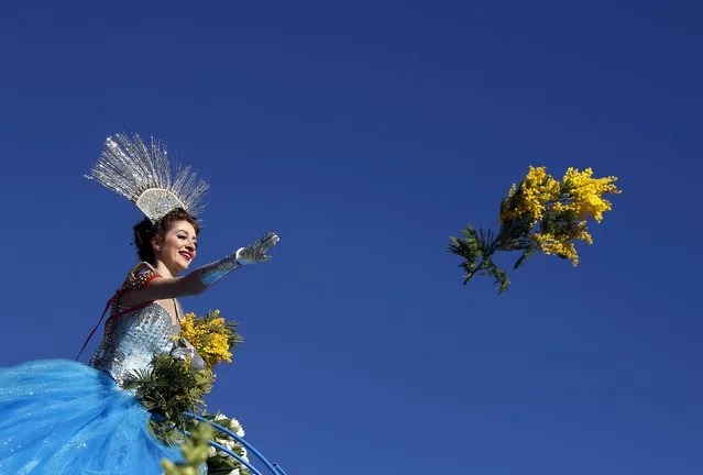 The Queen of the Carnival throws flowers during the flower parade part of the carnival in Nice, France, February 13, 2016. The 132nd Carnival of Nice will take place from February 13 to 28 and will celebrate the “King of Media”. (Photo by Eric Gaillard/Reuters)