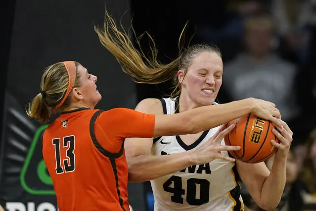 Bowling Green forward Olivia Hill (13) fights for a rebound with Iowa center Sharon Goodman (40) during the second half of an NCAA college basketball game, Saturday, December 2, 2023, in Iowa City, Iowa. Iowa won 99-65. (Photo by Charlie Neibergall/AP Photo)