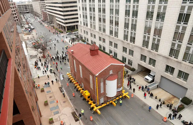 Washington's first and oldest synagogue, Adas Israel Synagogue, is moved via a remote controlled platform to its new location where it will become be the cornerstone of the Capital Jewish Museum on 3rd St. NW in Washington, U.S., January 9, 2019. (Photo by Kevin Lamarque/Reuters)