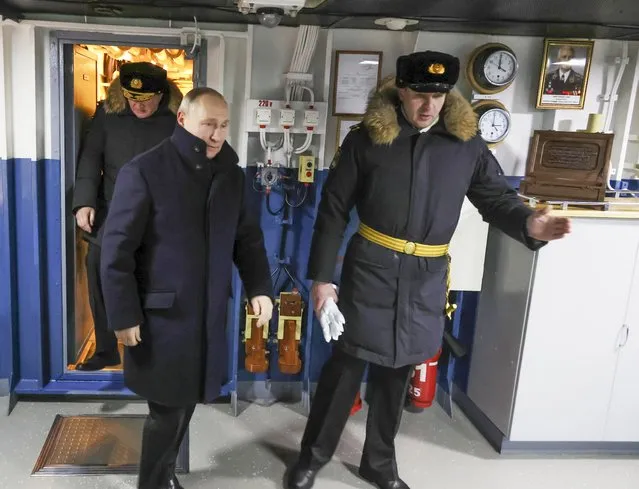 Russian President Vladimir Putin, left, visits the newest frigate “Admiral of the fleet Kasatonov” during a flag-raising ceremony on Monday for newly-built nuclear submarines at the Sevmash shipyard in Severodvinsk in Russia's Archangelsk region, Monday, December 11, 2023. The navy flag was raised on the Emperor Alexander III and the Krasnoyarsk submarines during Monday's ceremony. Putin has traveled to a northern shipyard to attend the commissioning of new nuclear submarines, a visit that showcases the country's nuclear might amid the fighting in Ukraine. (Photo by Sputnik, Kremlin Pool Photo via AP Photo)