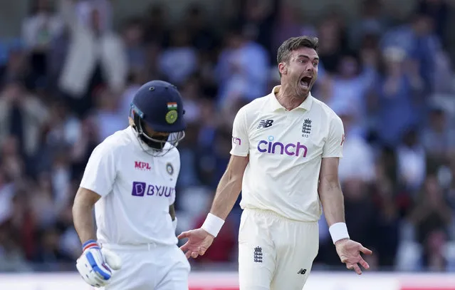 England's James Anderson, right, celebrates the dismissal of India's captain Virat Kohli, left, during the first day of third test cricket match between England and India, at Headingley cricket ground in Leeds, England, Wednesday, August 25, 2021. (Photo by Jon Super/AP Photo)